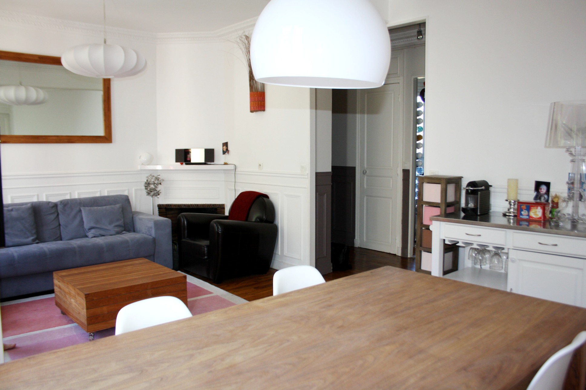 Séjour double appartement de type haussmannien avec parquet moulures cheminée du projet Brossolette